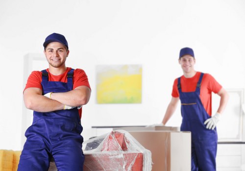 Furniture removals team handling household items in Ealing