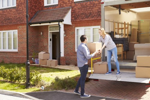 Moving van and boxes for a home relocation in Ealing
