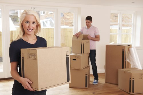Local movers transporting belongings from an Ealing flat