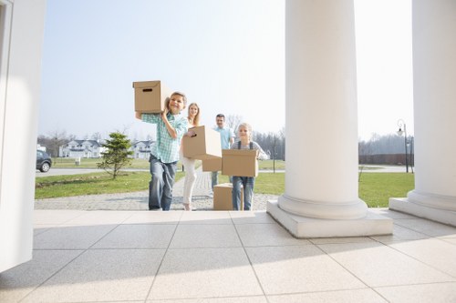Professional movers handling furniture during a same-day move in Ealing