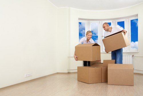 Loading household boxes and furniture into a removal truck