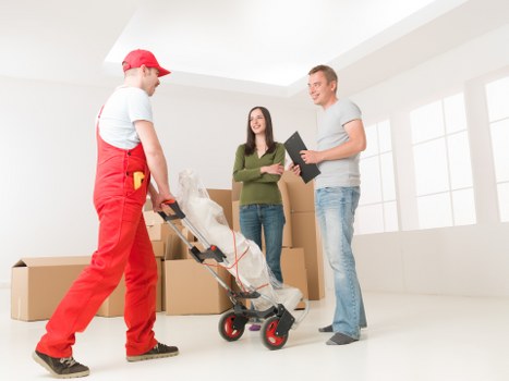 Office relocation setup with equipment and boxes prepared for transport