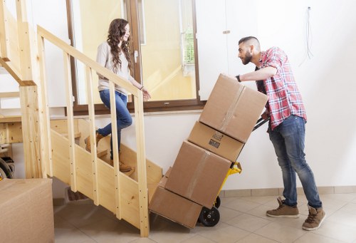 Mover handling furniture carefully during a local removal