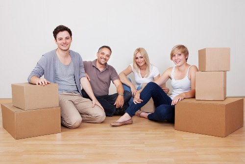 Professional movers handling stairs and apartment access during an Ealing relocation